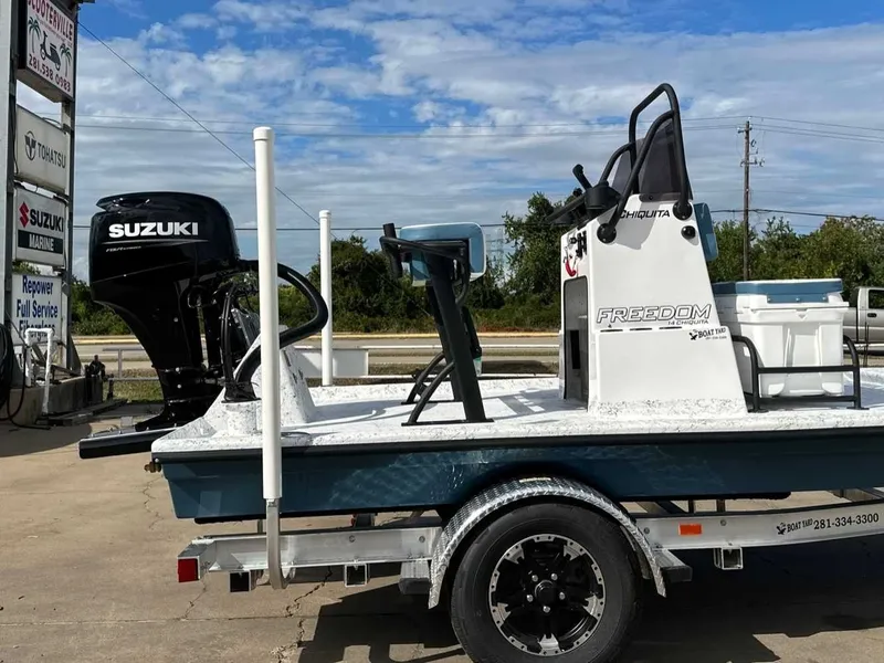 Slide: The Image of Freedom CHIQUITA 2026 boat with Suzuki engine on trailer. - 11