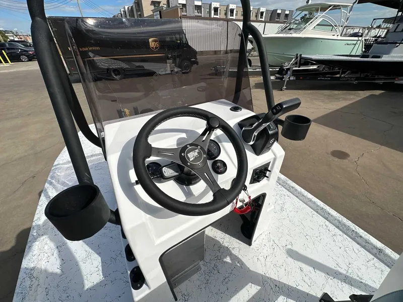 Slide: The Image of Freedom CHIQUITA 2026 boat steering console on a parking lot. - 13