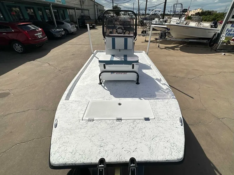 Slide: The Image of 2026 Freedom CHIQUITA boat on parking lot, front view. - 15