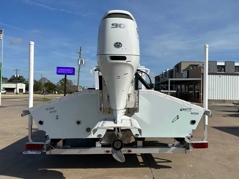 Slide: The Image of Rear view of a Freedom EAGLE boat with outboard motor, year 2026. - 10