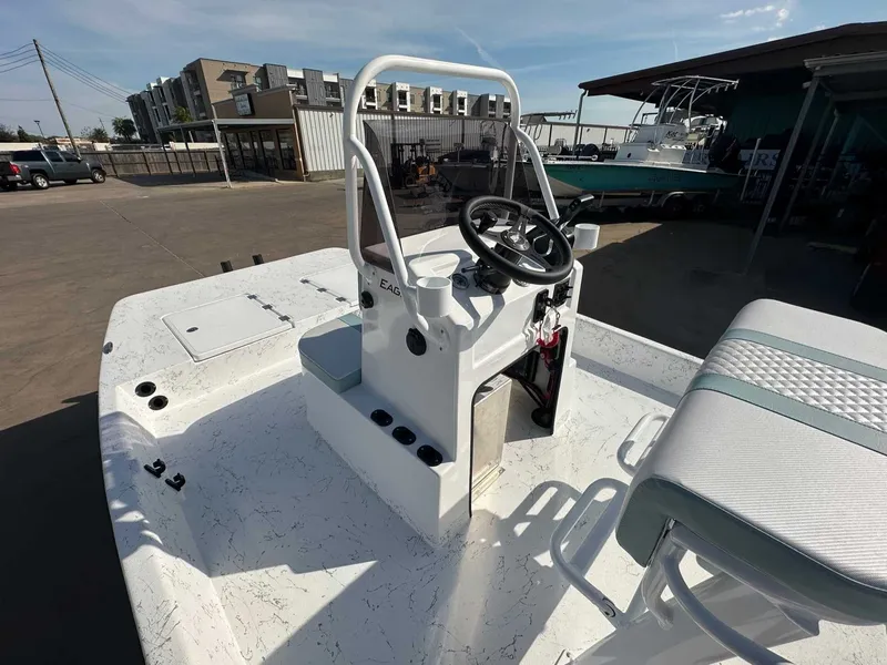 Slide: The Image of 2026 Freedom EAGLE boat parked outdoors, modern design. - 14