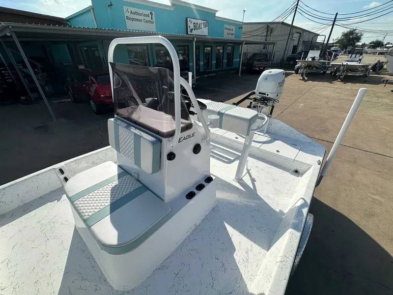 Slide: The Image of 2026 Freedom EAGLE boat on a parking lot. - 17