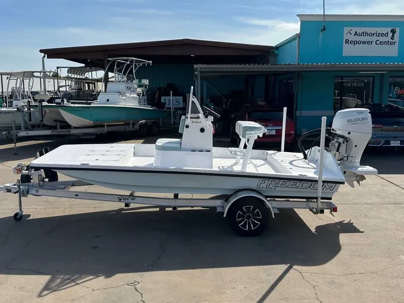 Slide: The Image of 2026 Freedom EAGLE boat at an authorized repower center. - 2