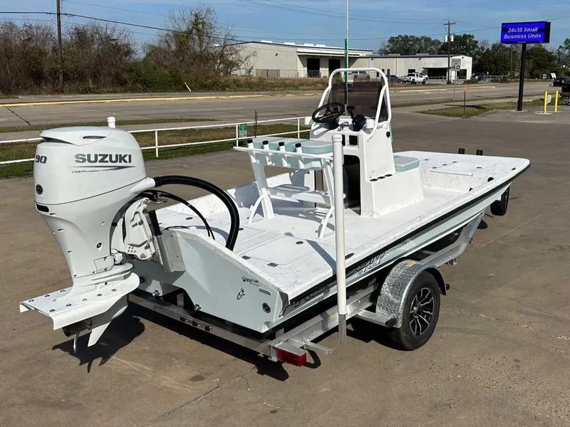 Slide: The Image of 2026 Freedom EAGLE boat with Suzuki engine on trailer. - 5