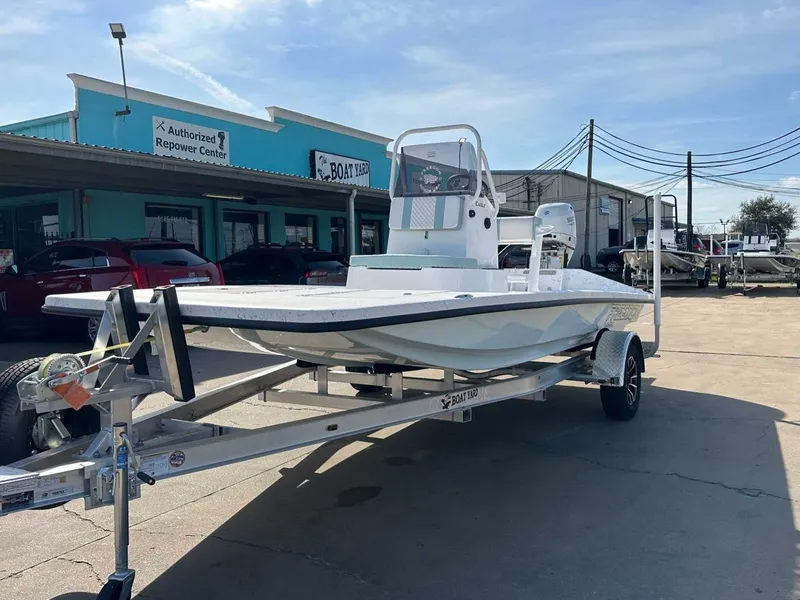 Slide: The Image of 2026 Freedom EAGLE boat on trailer outside shop. - 8