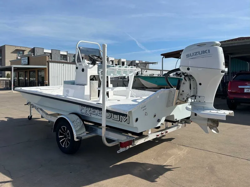 Slide: The Image of 2026 Freedom EAGLE boat with Suzuki outboard motor. - 9
