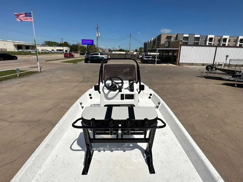 Slide: The Image of 2026 Freedom EAGLE boat on parking lot with American flag. - 13