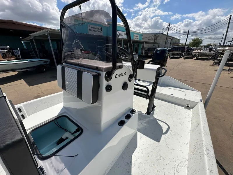 Slide: The Image of 2026 Freedom EAGLE boat on shipyard premises under sunny skies. - 16