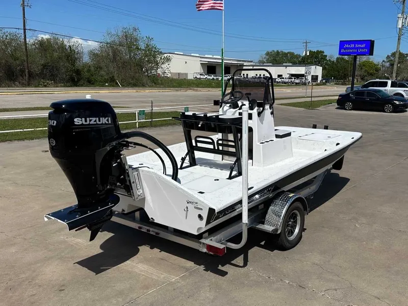 Slide: The Image of 2026 Freedom EAGLE boat with Suzuki engine on trailer. - 5