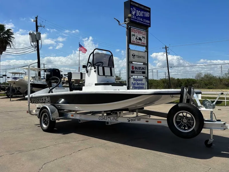 Slide: The Image of Freedom EAGLE 2026 boat on trailer in sunny weather. - 7