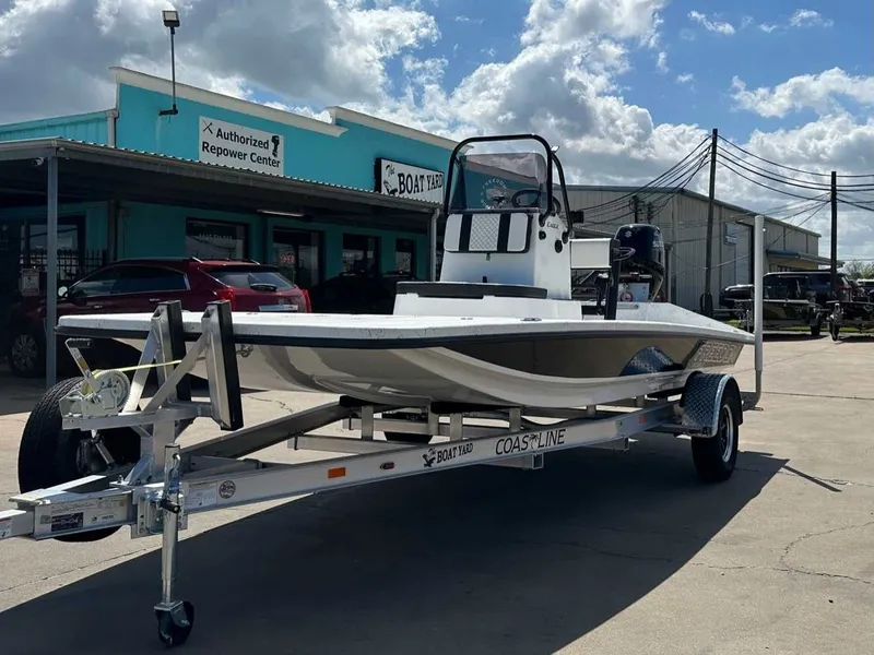 Slide: The Image of Freedom EAGLE 2026 boat on trailer outside workshop. - 8