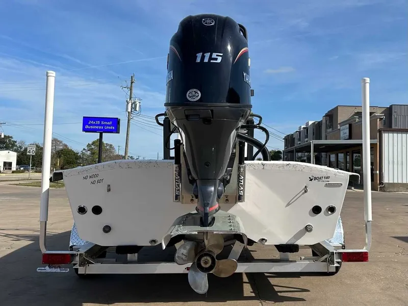 Slide: The Image of Rear view of a 2026 Freedom PATRIOT boat with outboard motor. - 10