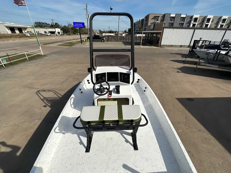 Slide: The Image of 2026 Freedom PATRIOT boat on parking lot with American flag. - 13