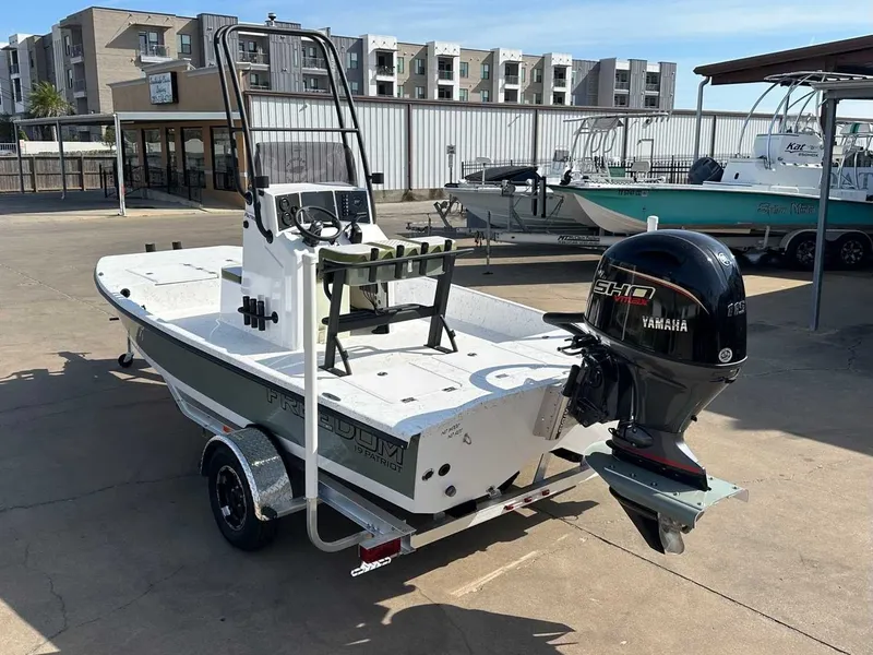 Slide: The Image of 2026 Freedom PATRIOT boat with Yamaha engine on trailer. - 3