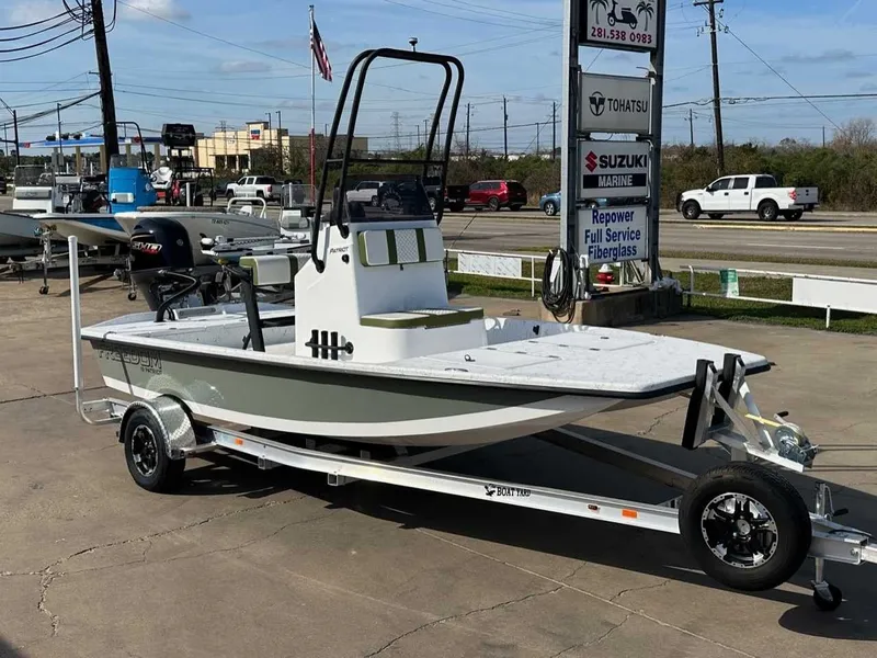 Slide: The Image of 2026 Freedom PATRIOT boat on trailer parked outdoors. - 6