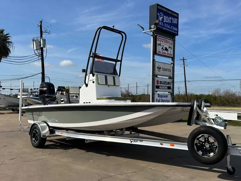 Slide: The Image of 2026 Freedom PATRIOT boat on trailer at boat dealership. - 7