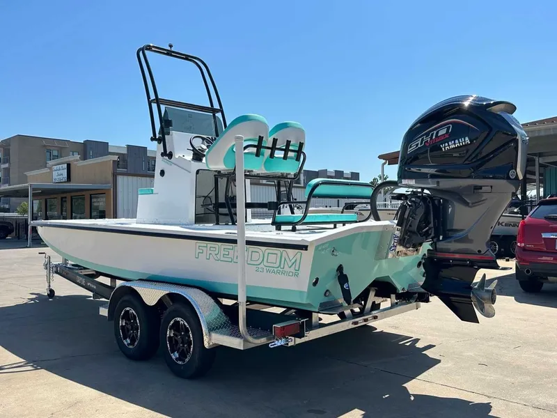 Slide: The Image of Freedom Warrior 2026 boat with Yamaha outboard motor on trailer. - 10