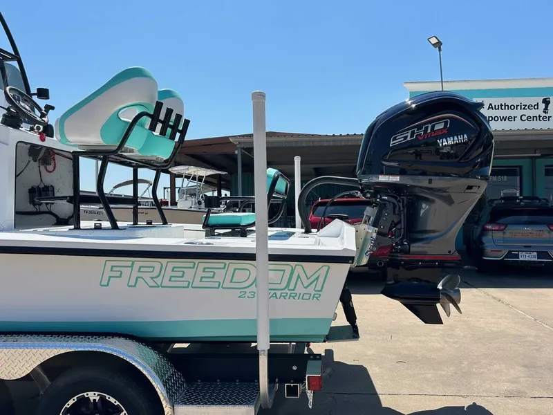 Slide: The Image of Freedom Warrior 2026 boat with Yamaha engine at dock. - 11