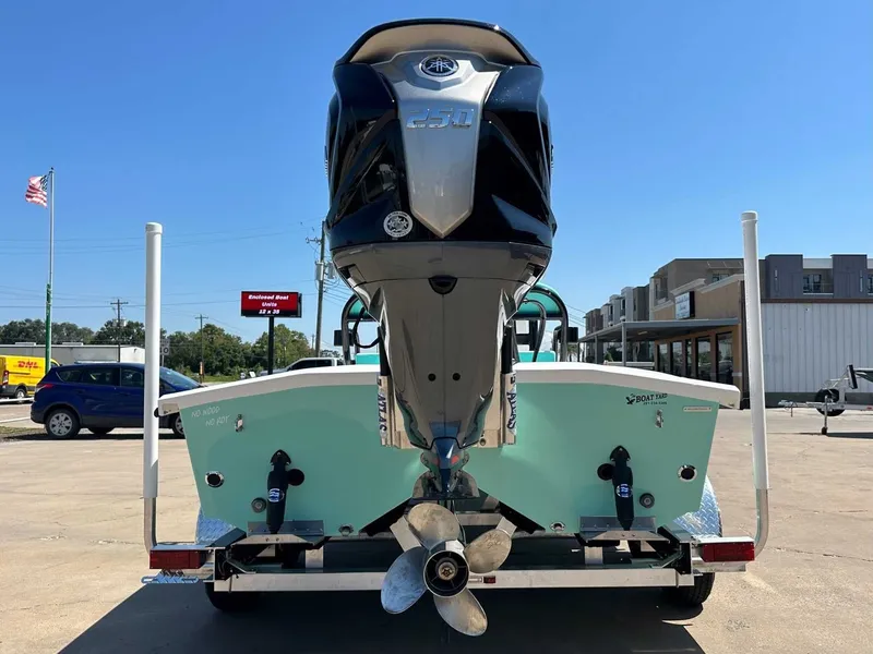 Slide: The Image of Rear view of a Freedom Warrior 2026 boat with outboard motor. - 12