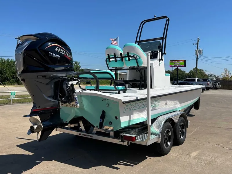 Slide: The Image of Freedom Warrior 2026 boat with Yamaha engine on trailer. - 13