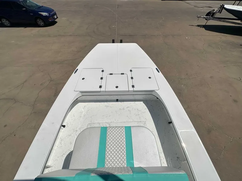 Slide: The Image of 2026 Freedom Warrior boat with turquoise seat on parking lot. - 18