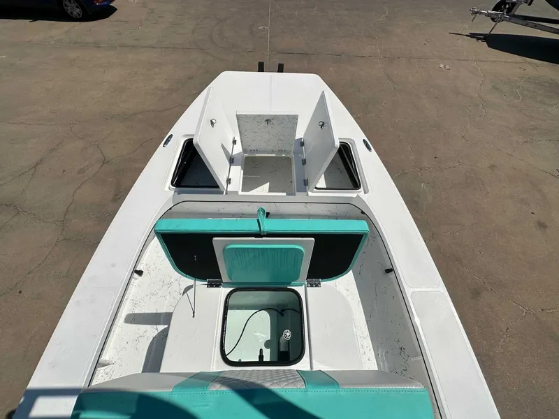 Slide: The Image of 2026 Freedom Warrior boat with storage compartments and turquoise accents. - 19