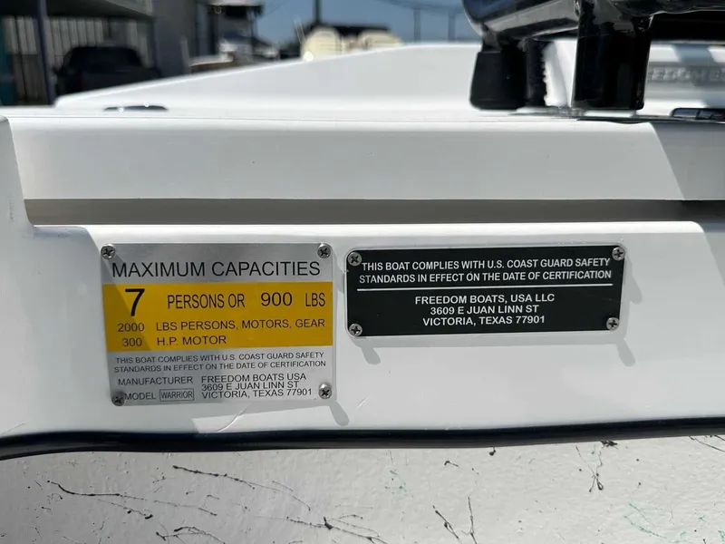 Slide: The Image of Capacity label for Freedom Warrior 2026 boat, maximum persons and weight load. - 25