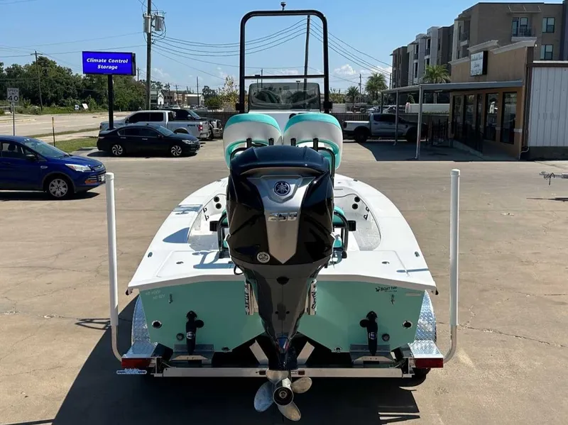 Slide: The Image of 2026 Freedom Warrior boat on trailer, parking lot view. - 4