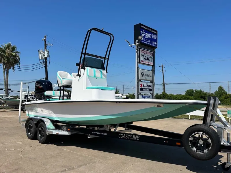 Slide: The Image of 2026 Freedom Warrior boat on trailer outdoors. - 7