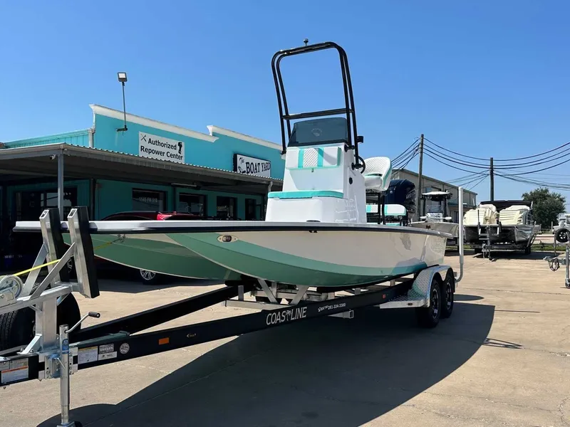 Slide: The Image of Freedom Warrior 2026 boat on trailer outside workshop. - 9