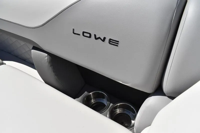 Slide: The Image of 2026 Lowe SS 230 boat interior with logo and cup holders. - 1