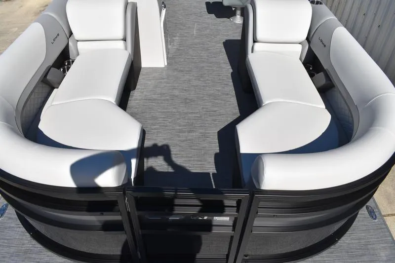 Slide: The Image of 2026 Lowe SS 230 pontoon boat interior with white seating and gray flooring. - 11