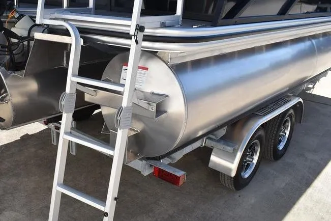Slide: The Image of 2026 Lowe SS 230 pontoon boat on trailer with ladder and dual axles. - 16