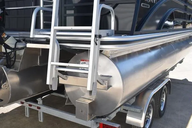 Slide: The Image of 2026 Lowe SS 230 pontoon boat on trailer, rear view with ladder and pontoons. - 18