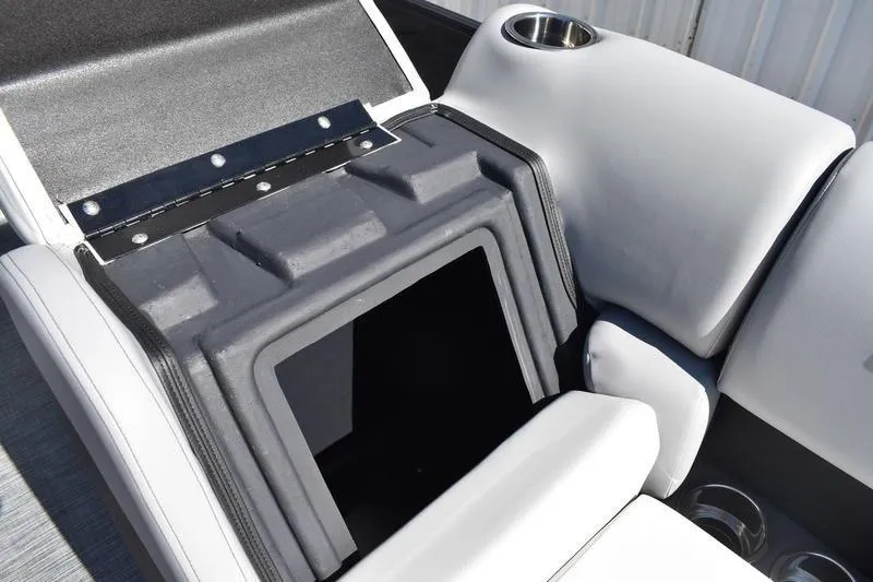 Slide: The Image of Interior storage compartment of 2026 Lowe SS 230 boat with cup holder. - 22