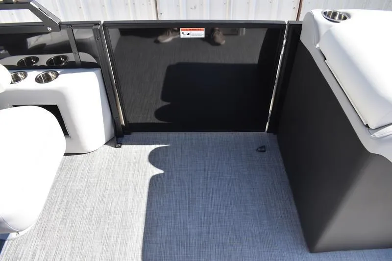 Slide: The Image of Interior of 2026 Lowe SS 230 boat with seating and cup holders. - 24