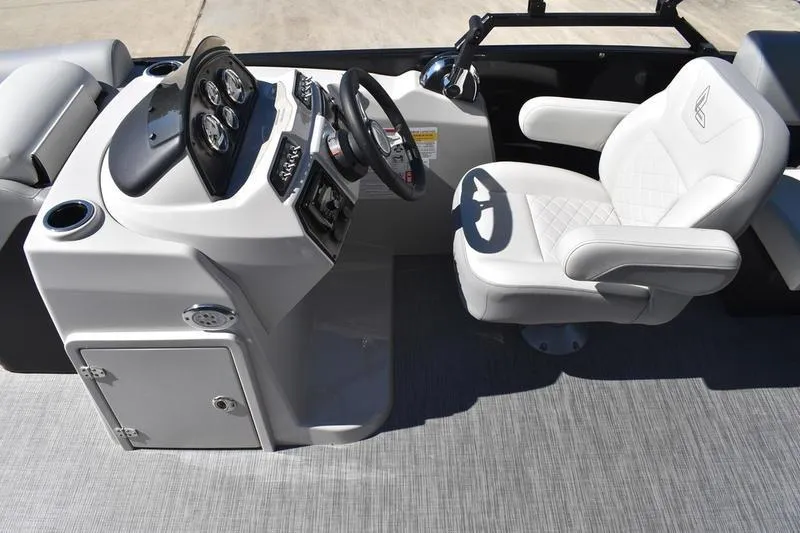 Slide: The Image of 2026 Lowe SS 230 boat interior with steering console and cushioned captain's chair. - 28