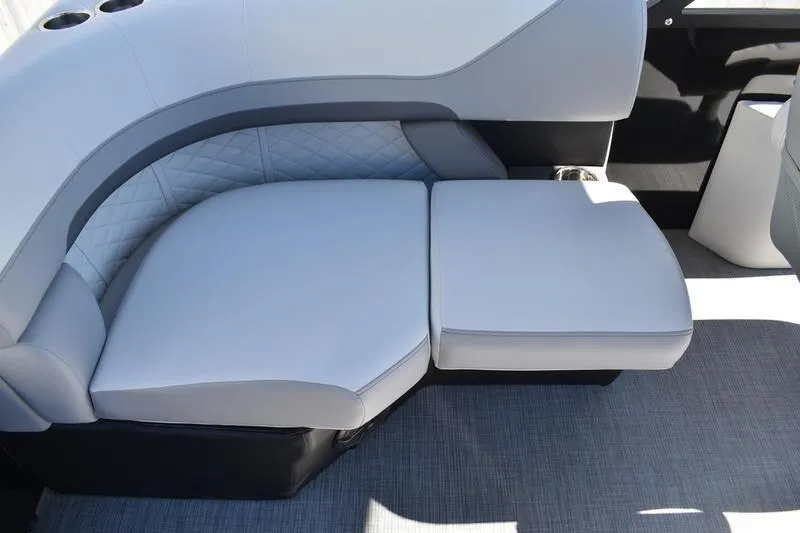 Slide: The Image of Luxurious seating on 2026 Lowe SS 230 boat with quilted upholstery and cup holders. - 31