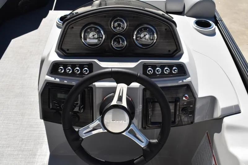 Slide: The Image of 2026 Lowe SS 230 boat dashboard with steering wheel and instrument panel. - 33
