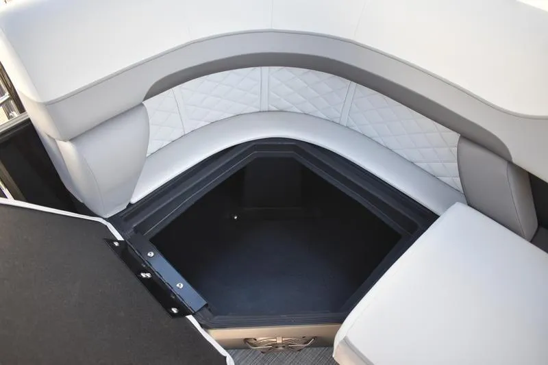 Slide: The Image of 2026 Lowe SS 230 boat interior with cushioned seating and storage compartment. - 34