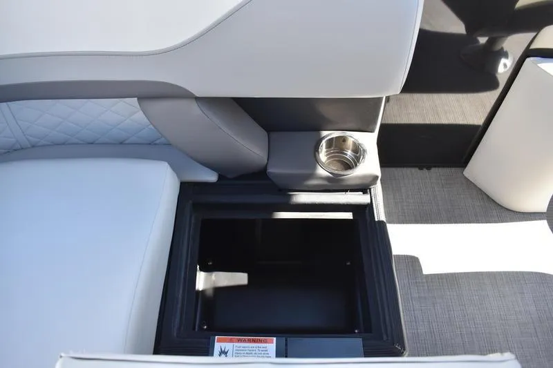 Slide: The Image of Interior of 2026 Lowe SS 230 boat with storage compartment and cup holder. - 37