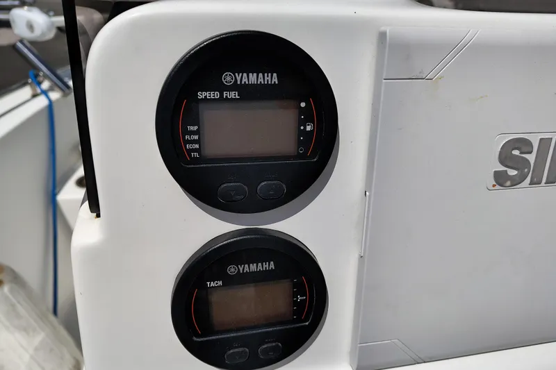 Slide: The Image of Yamaha gauges on 2017 Sea Hunt Triton 188 boat dashboard. - 11