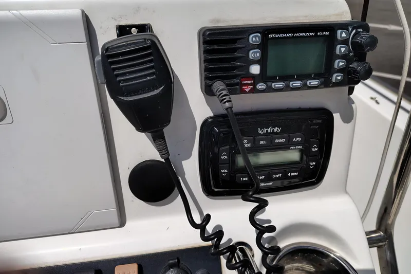 Slide: The Image of Control panel of a 2017 Sea Hunt Triton 188 boat with radio and audio system. - 12