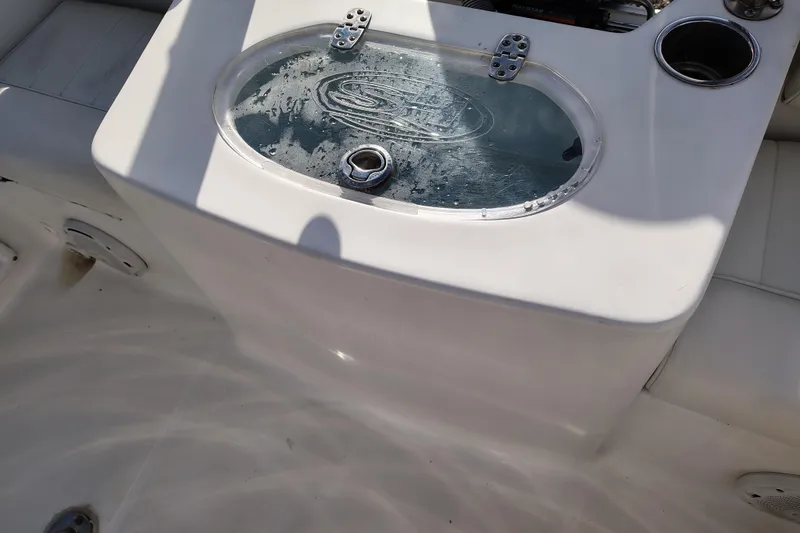 Slide: The Image of 2017 Sea Hunt Triton 188 boat interior with livewell and cup holder. - 18