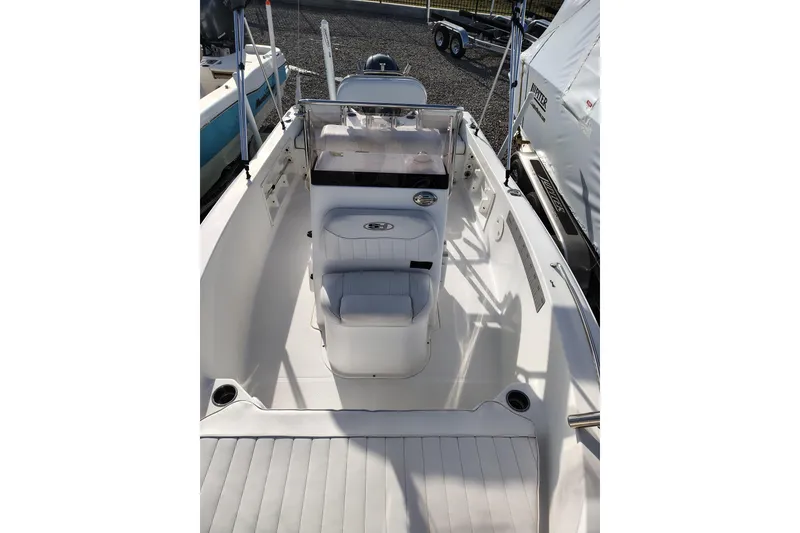 Slide: The Image of 2017 Sea Hunt Triton 188 boat interior with seating and console, showcasing sleek design. - 20