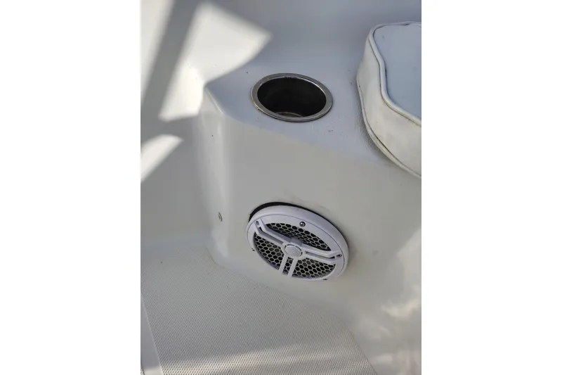 Slide: The Image of Cup holder and speaker on 2017 Sea Hunt Triton 188 boat interior. - 21