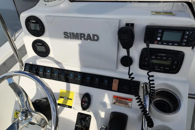 Slide: The Image of Control panel of a 2017 Sea Hunt Triton 188 boat with Simrad electronics. - 9
