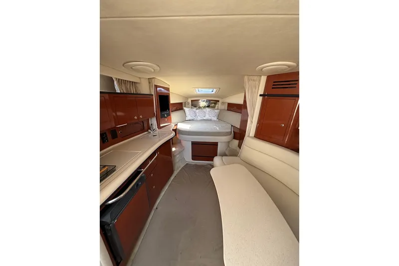 Slide: The Image of Interior of 2003 Sea Ray Sundancer 320 yacht with cozy cabin and modern amenities. - 11