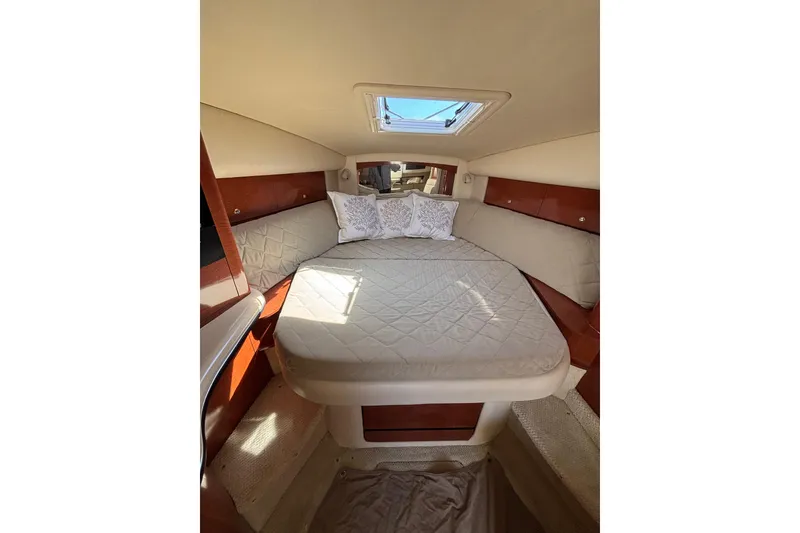 Slide: The Image of Interior cabin of 2003 Sea Ray Sundancer 320 with cozy bed and skylight. - 13