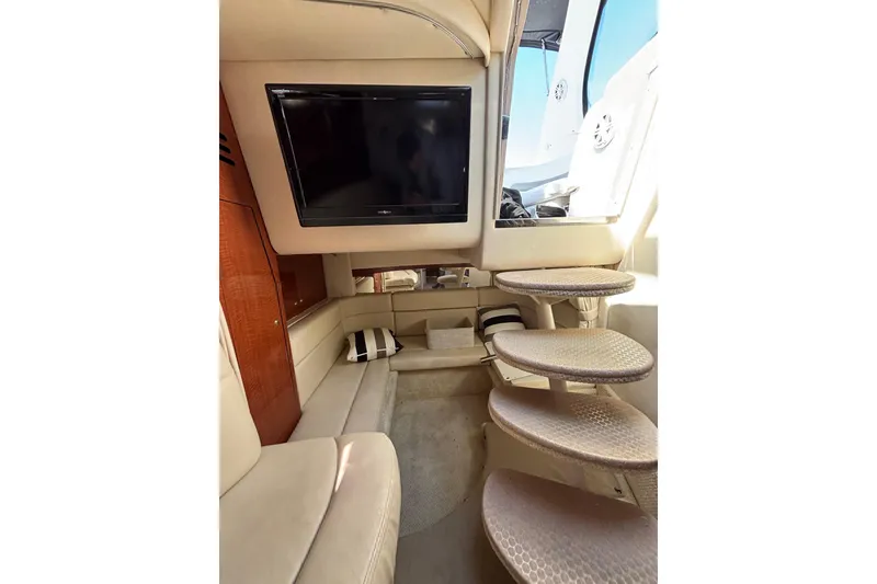 Slide: The Image of Interior of 2003 Sea Ray Sundancer 320 yacht with TV, seating, and stairs. - 9